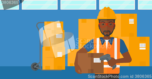 Image of Worker checking barcode on box.