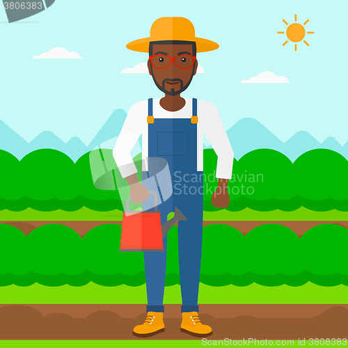 Image of Farmer with watering can.