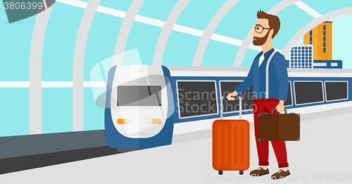 Image of Man with suitcase on wheels and briefcase.