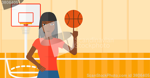 Image of Basketball player spinning ball.