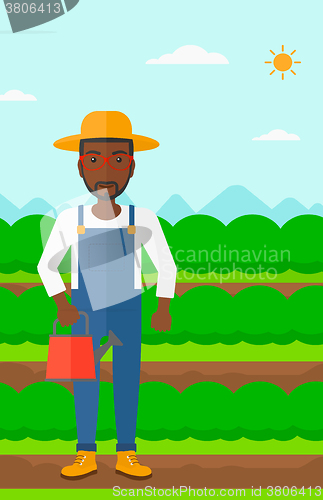 Image of Farmer with watering can.