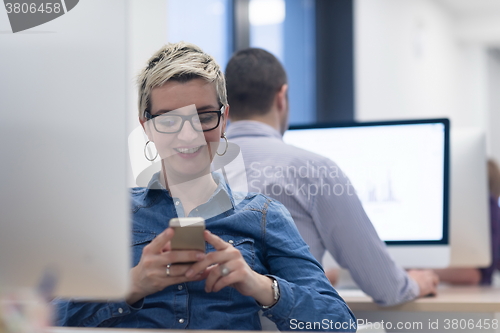 Image of startup business, woman  working on desktop computer