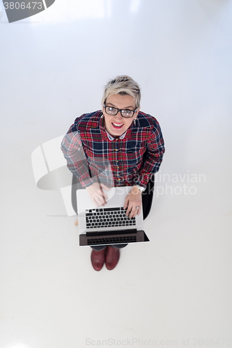 Image of top view of young business woman working on laptop computer