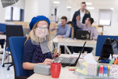 Image of startup business, woman  working on laptop