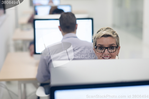 Image of startup business, woman  working on desktop computer