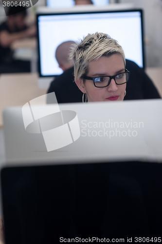 Image of startup business, woman  working on desktop computer