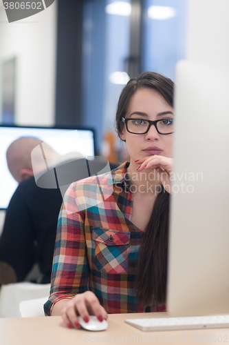 Image of startup business, woman  working on desktop computer