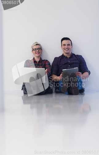 Image of startup business, couple working on laptop computer at office