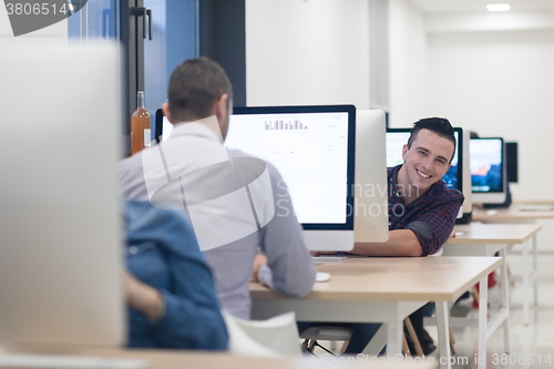Image of startup business, software developer working on desktop computer