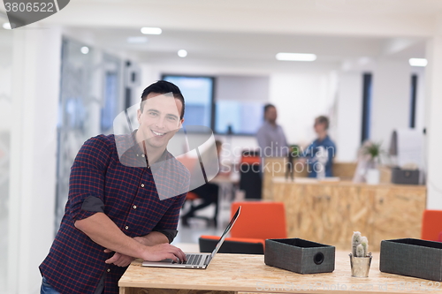 Image of startup business, young  man portrait at modern office