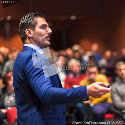 Image of Public speaker giving talk at Business Event.