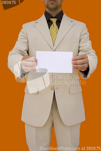 Image of businessman holding his card