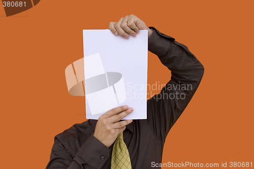 Image of Businessman holding a paper face