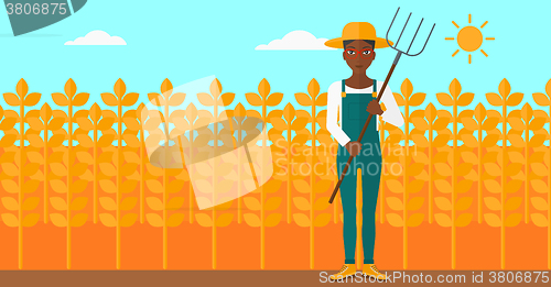 Image of Farmer with pitchfork.