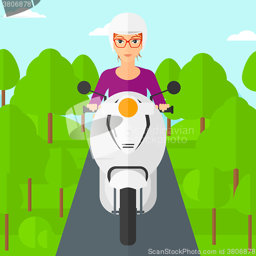 Image of Woman riding scooter.