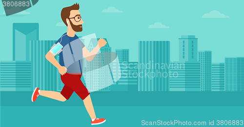 Image of Man jogging with earphones and smartphone.