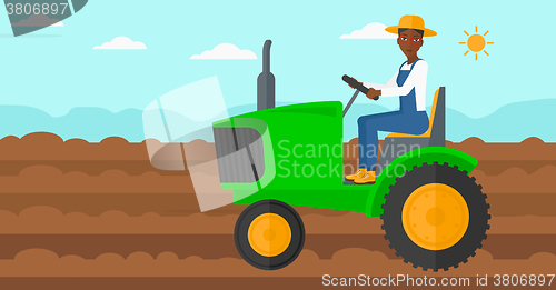 Image of Farmer driving tractor.