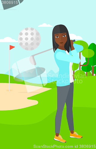 Image of Golf player hitting the ball.