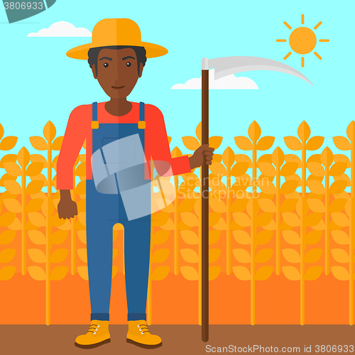 Image of Farmer on the field with scythe.