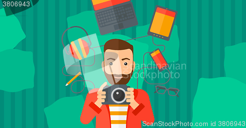 Image of Man holding camera.