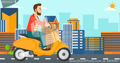 Image of Man riding scooter.