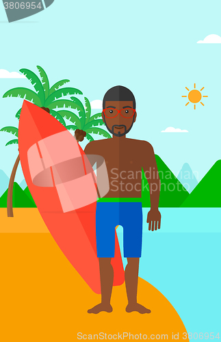 Image of Surfer holding surfboard.