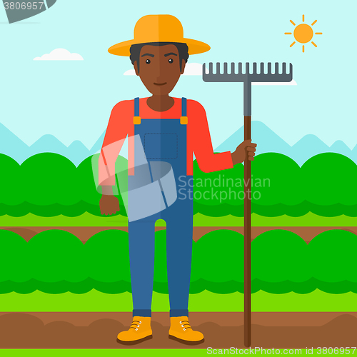 Image of Farmer with rake.