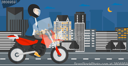 Image of Woman riding motorcycle.