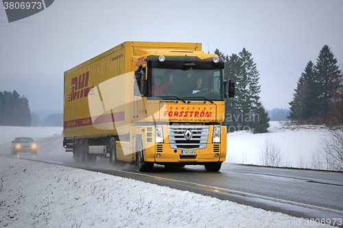 Image of Yellow Renault Magnum Semi Truck Hauls in Winter