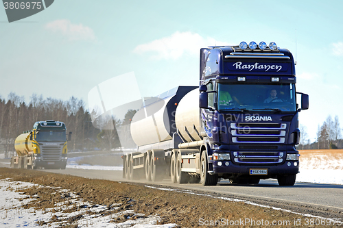 Image of Two Scania Tank Trucks Platoon along Spring Highway