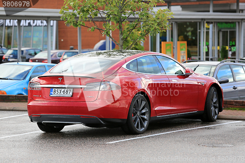 Image of Red Tesla Model S P85D Electric Car Parked