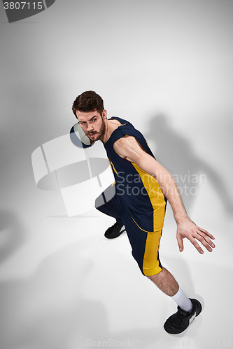 Image of Full length portrait of a basketball player with ball 