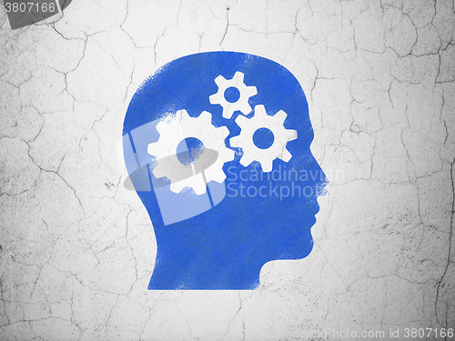 Image of Finance concept: Head With Gears on wall background