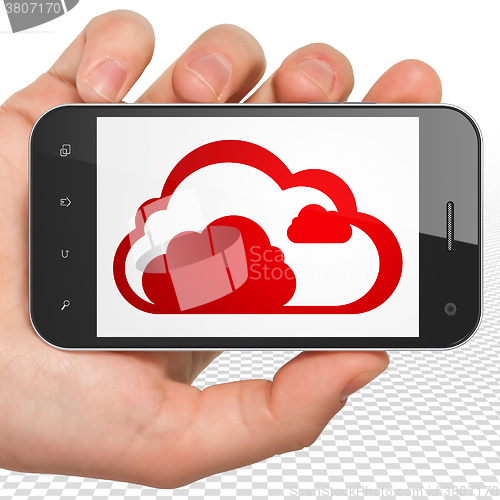Image of Cloud computing concept: Hand Holding Smartphone with Cloud on display