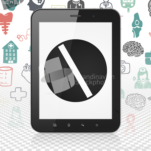 Image of Health concept: Tablet Computer with Pill on display