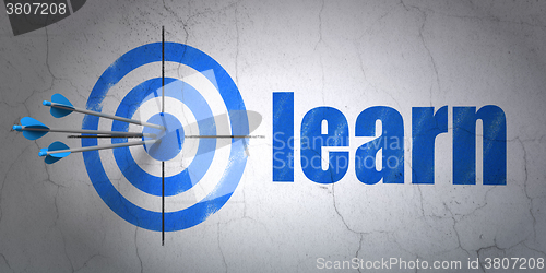 Image of Education concept: target and Learn on wall background