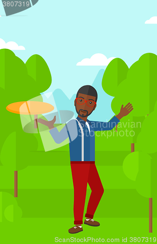Image of Man playing frisbee.