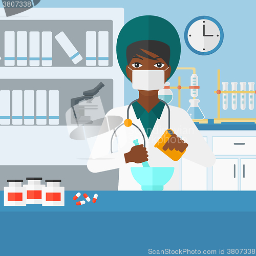 Image of Pharmacist preparing medicine.