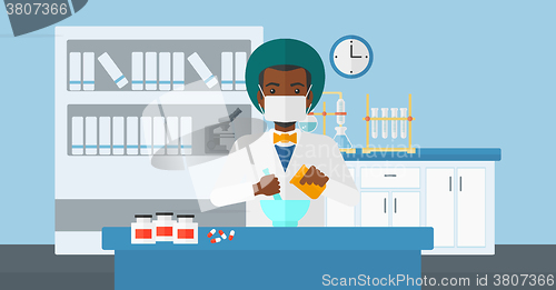 Image of Pharmacist preparing medicine.