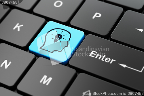 Image of Finance concept: Head With Lightbulb on computer keyboard background