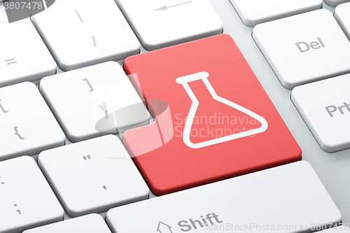 Image of Science concept: Flask on computer keyboard background