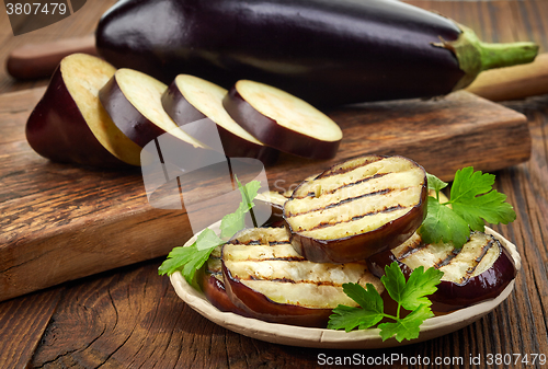 Image of grilled eggplant on wooden table
