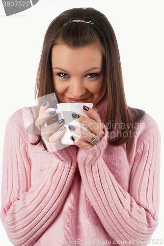 Image of Young attractive woman with cup