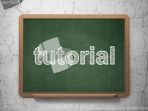 Image of Education concept: Tutorial on chalkboard background