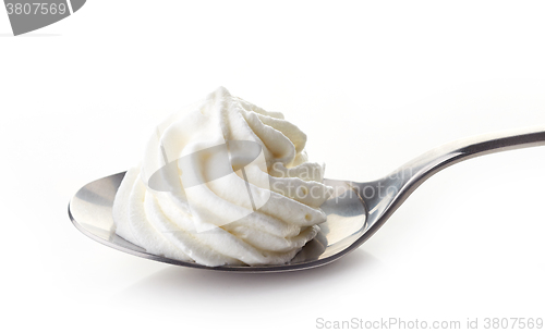 Image of spoon of whipped cream
