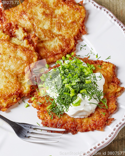 Image of potato pancakes on white plate