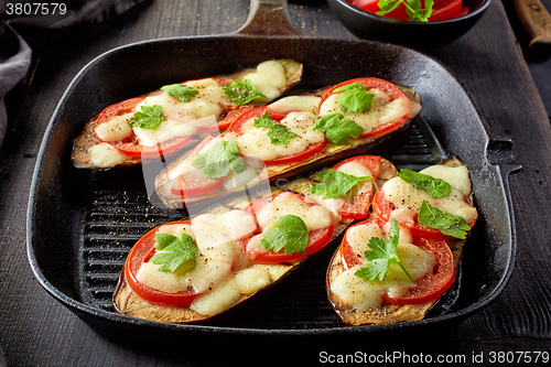 Image of Baked eggplant with tomatoes and cheese