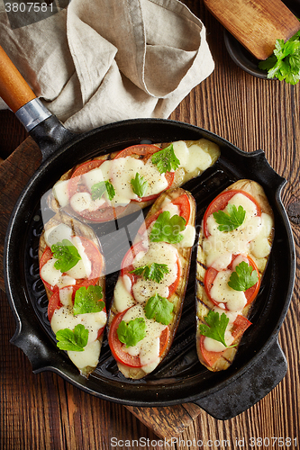 Image of grilled eggplants on cooking pan