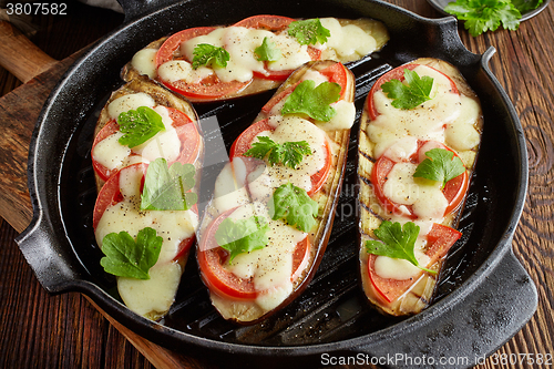 Image of grilled eggplants on cooking pan