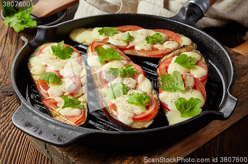 Image of grilled eggplants on cooking pan